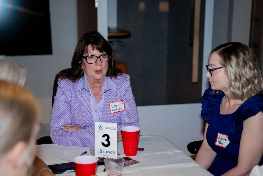 Roundtable discussion with professionals seated at a table